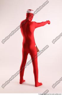 06 2019 01 JOEL ADAMSON CHRISTMAS VILLAIN WITH TWO GUNS